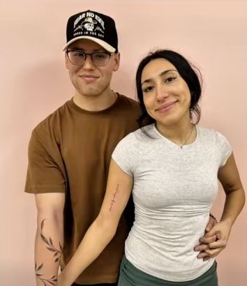 A couple showing their tattoos in the linked Wild Iris reel